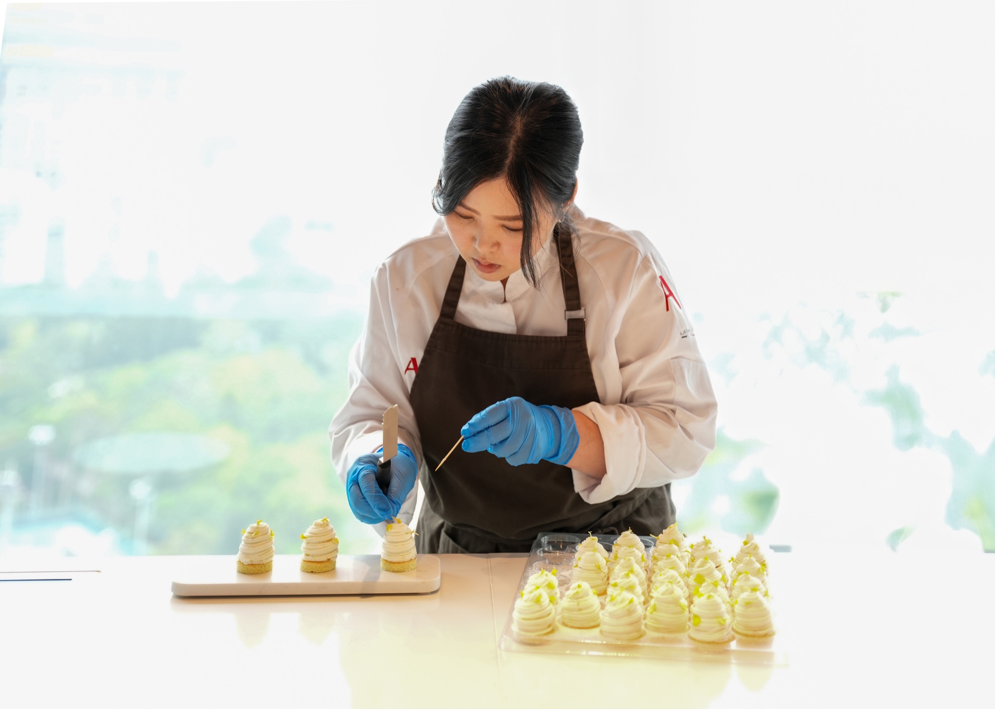 Chef plating dishes at Bidfood Akademia